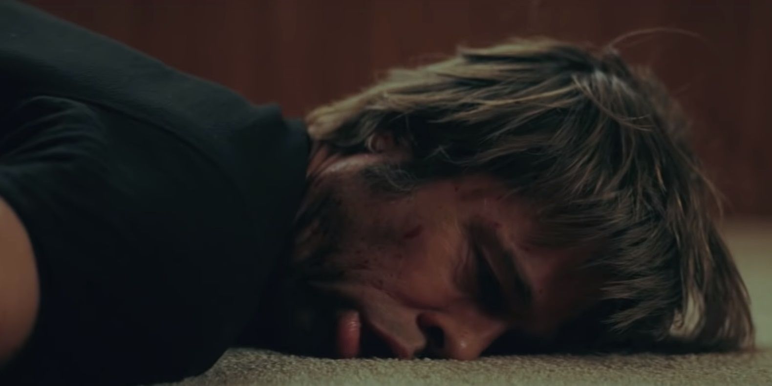 Cliff Booth lays on the floor after being stabbed in Once Upon a Time in Hollywood