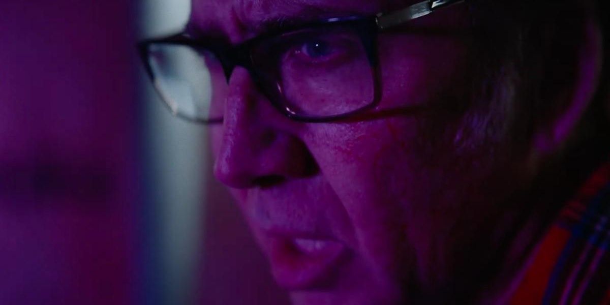 Nicolas Cage in close-up lit by a purplish light in Color Out of Space
