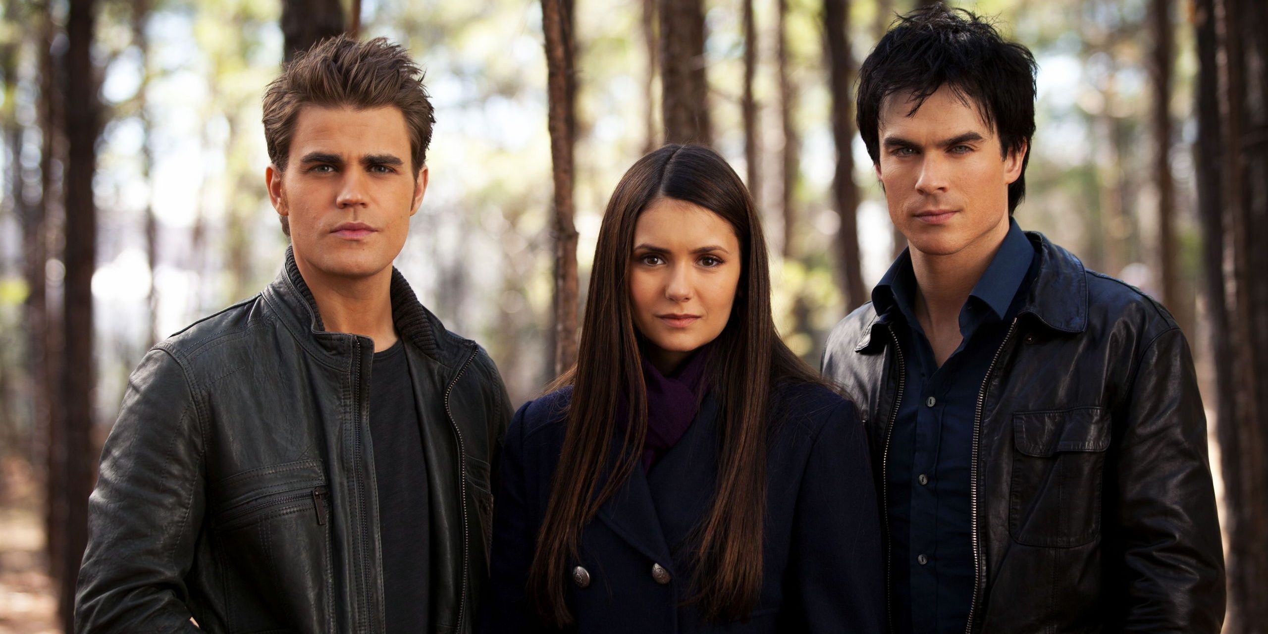 An image of Damon, Elena, and Stefan standing together in The Vampire Diaries 