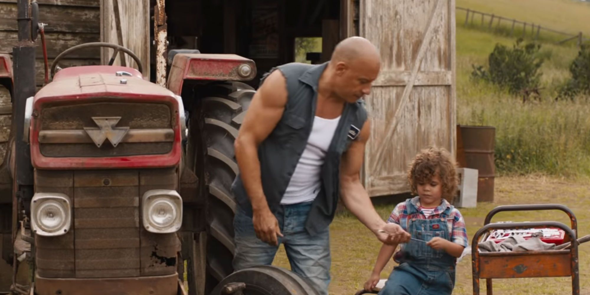 Dom fixes a tractor with his son Brian in F9