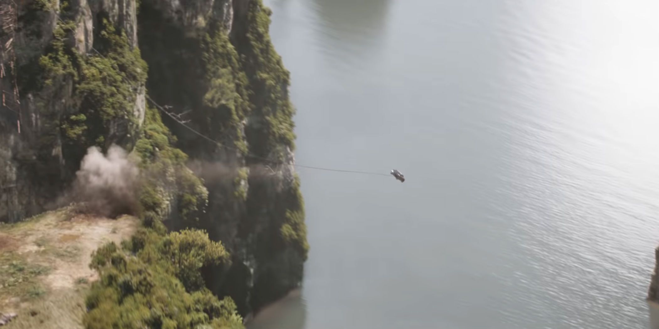 A car flies off a cliff with a bungie cable in F9.