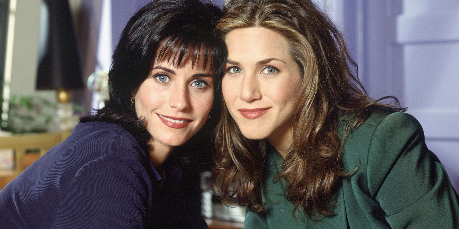 Monica and Rachel posing for a photo in Friends.