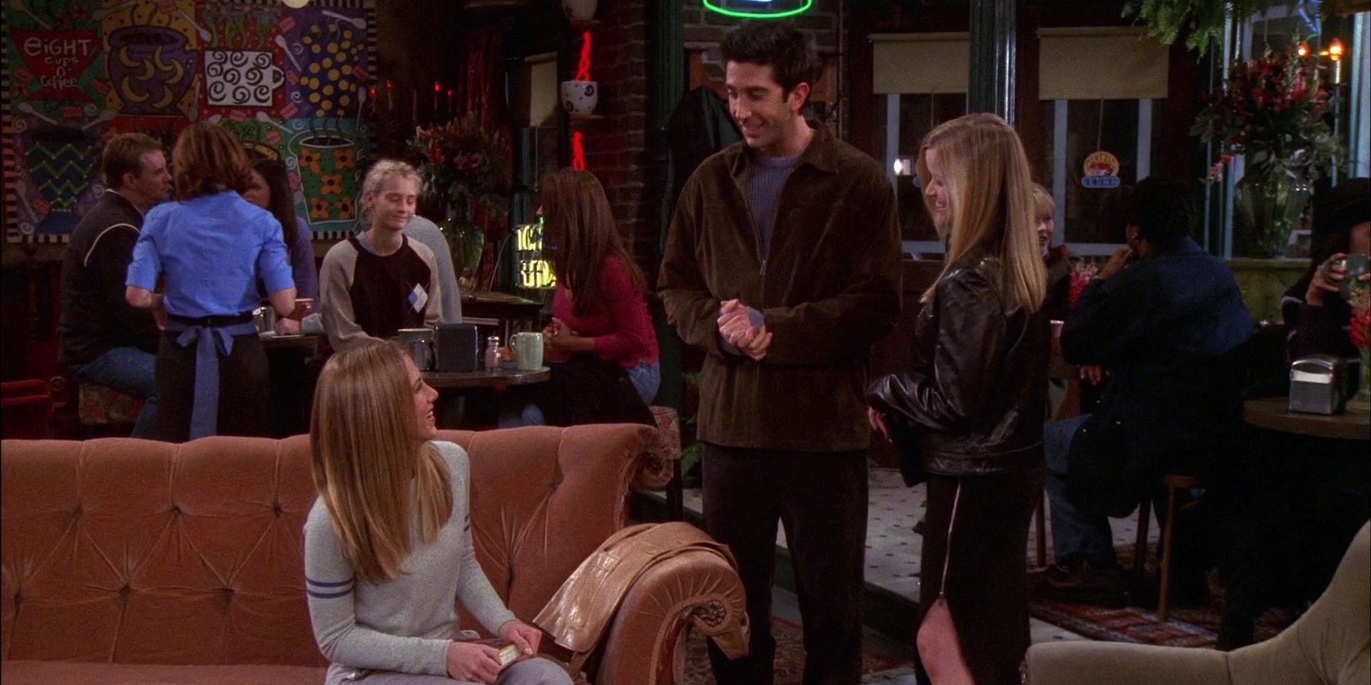 Rachel, Jill and Ross stand awkwardly in Central Perk in Friends