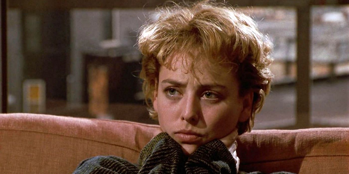 Virginia Madsen as Helen Lyle on a couch in Candyman 1992