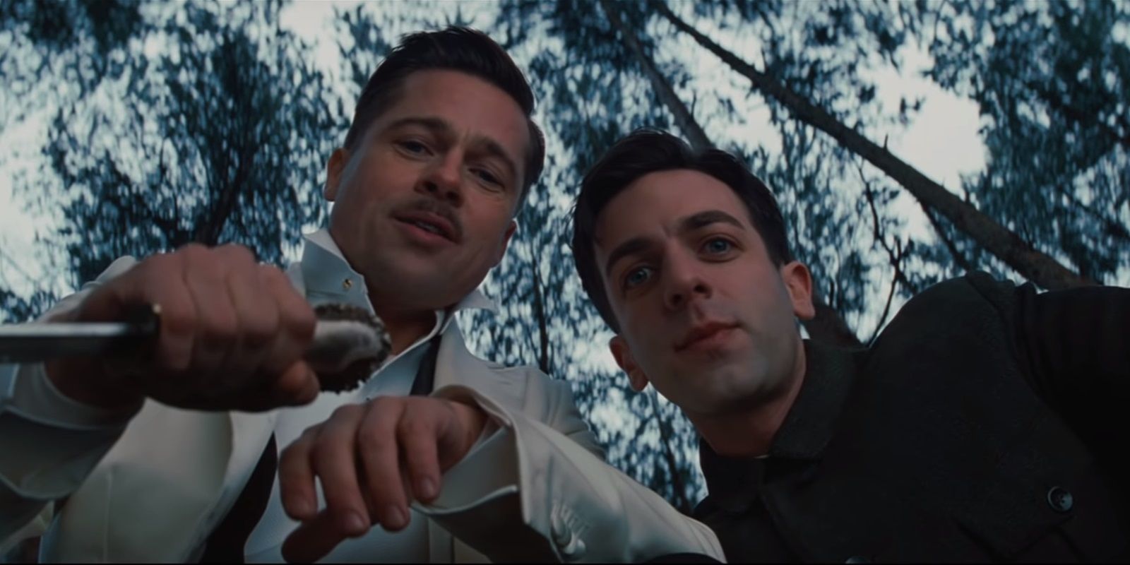 Two men looking down at someone offscreen in Inglourious Basterds.