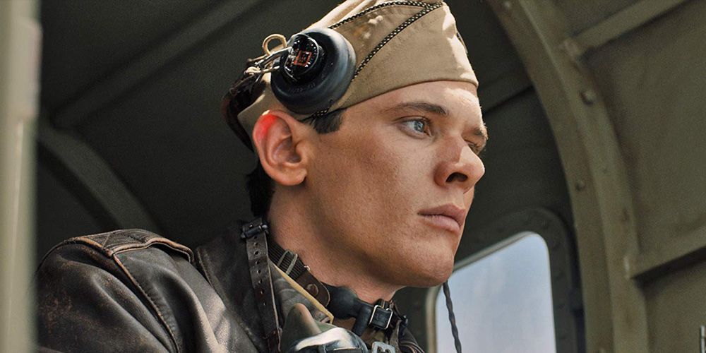 Jack O Connell on a plane in a still from Unbroken