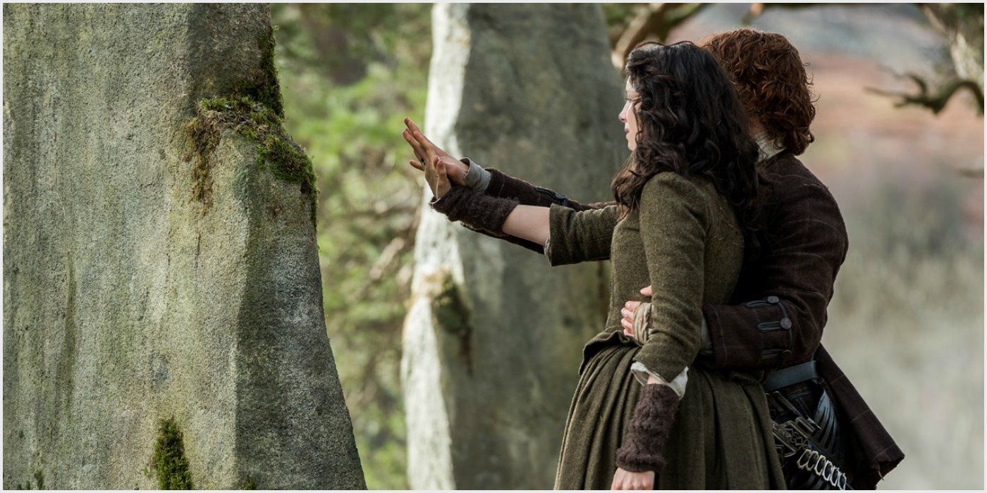 Jamie helping Claire to touch the stones and travel back to her time from Outlander