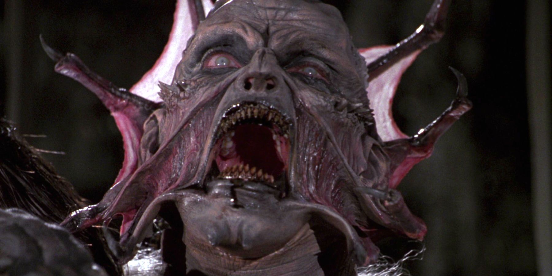 A closeup of the Creeper making a scary face in Jeepers Creepers