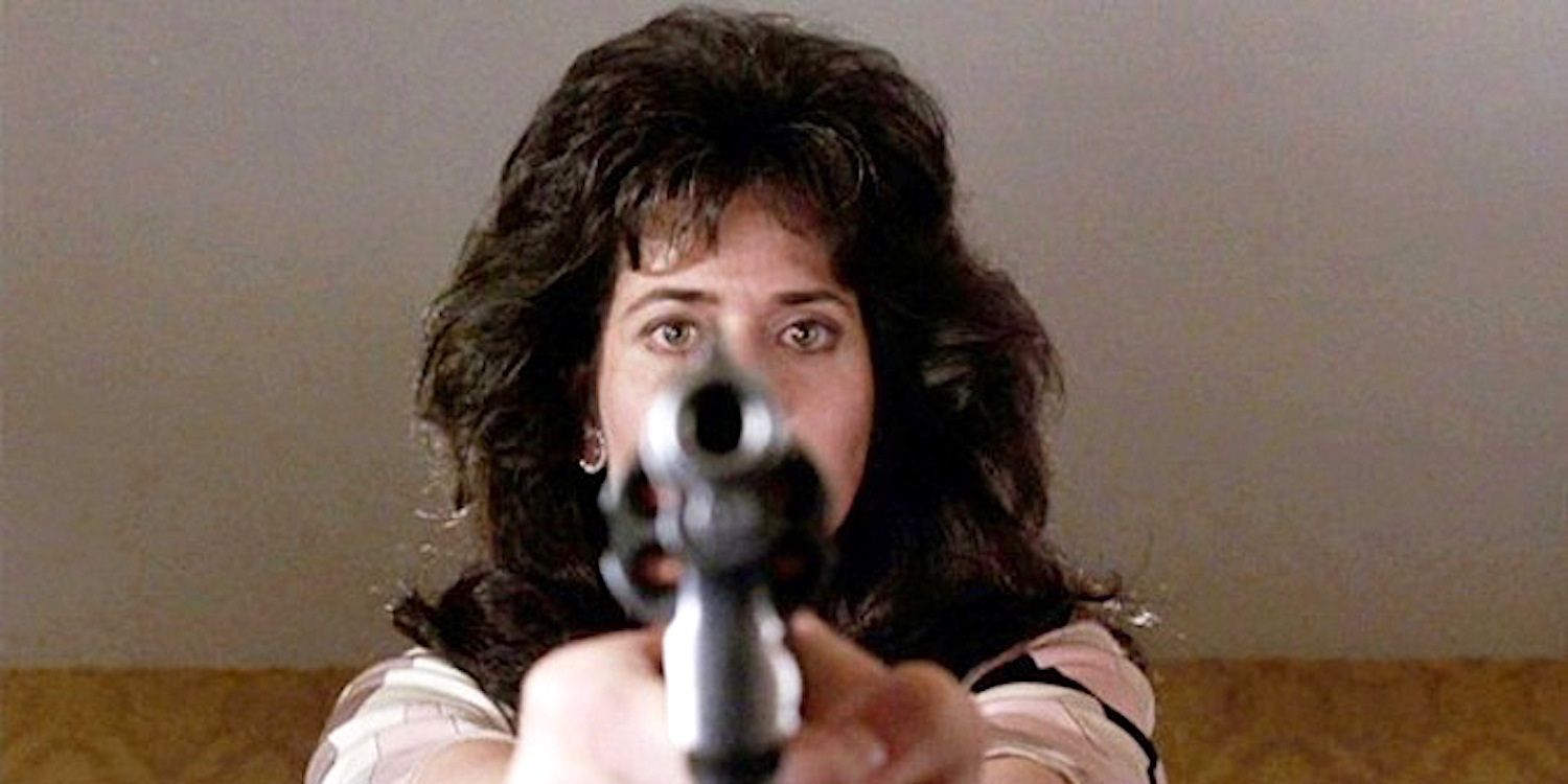 Karen points a gun at a sleeping Henry in Goodfellas