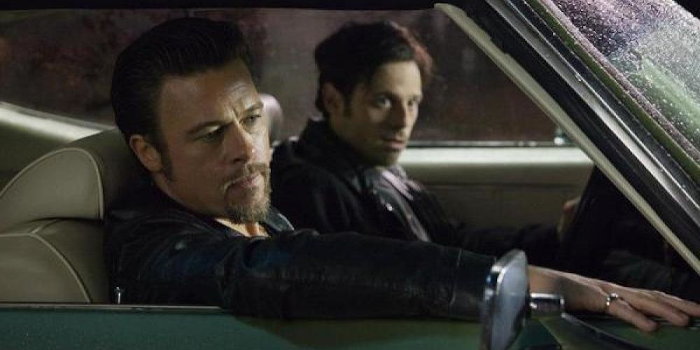 The hitman with a partner sitting in a car in Killing Them Softly