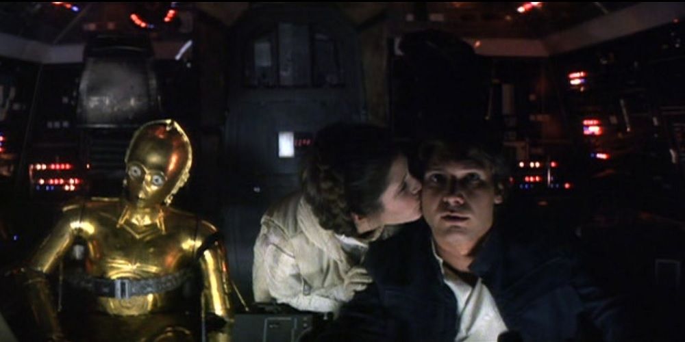 Leia Organa kisses Han Solo on the cheek in Star Wars Empire Strikes Back