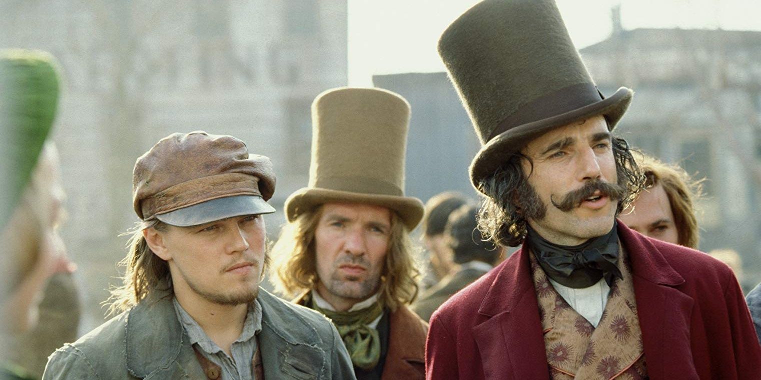 Leonardo DiCaprio, Daniel Day-Lewis, and Gary McCormack standing in the street in Gangs of New York (2002)