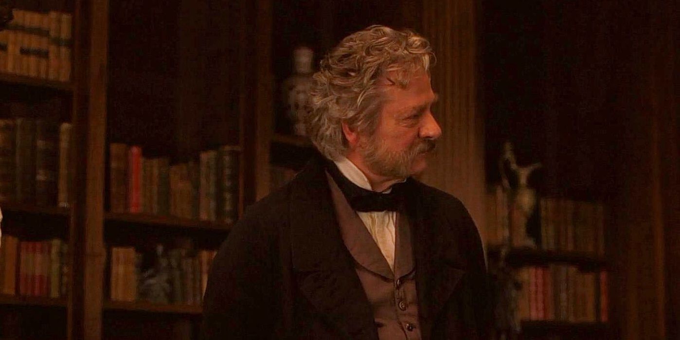 Mr Laurence from Little Women standing in a darkened library