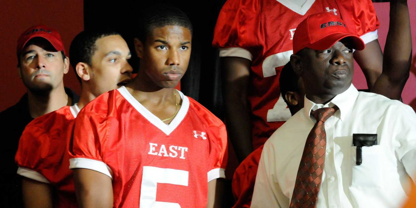 Michael B Jordan as Vince Howard entering a game in Friday Night Lights.