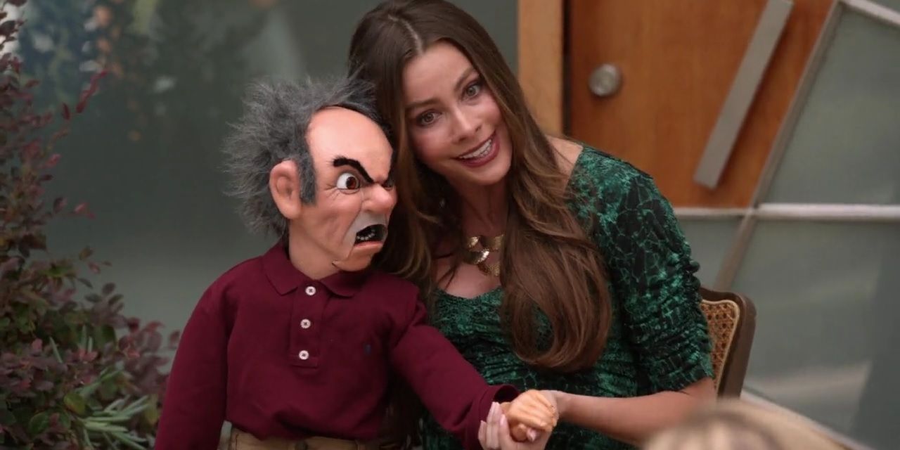 Modern Family - Gloria posing as a Ventriloquist with a dummy