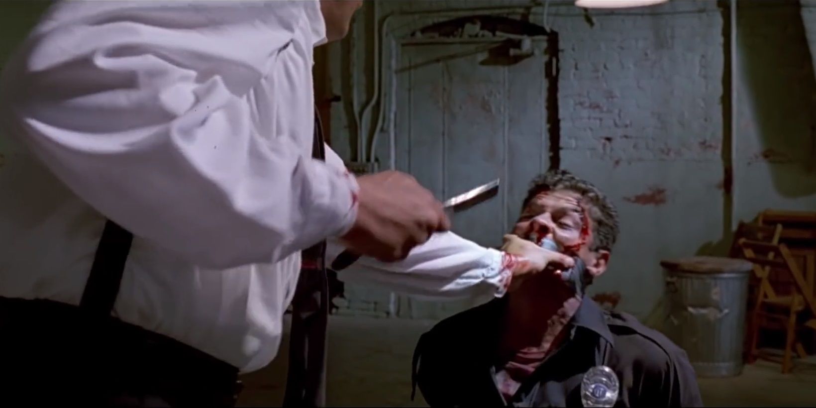 Mr Blonde cuts off Marvin Nash's ear in Reservoir Dogs