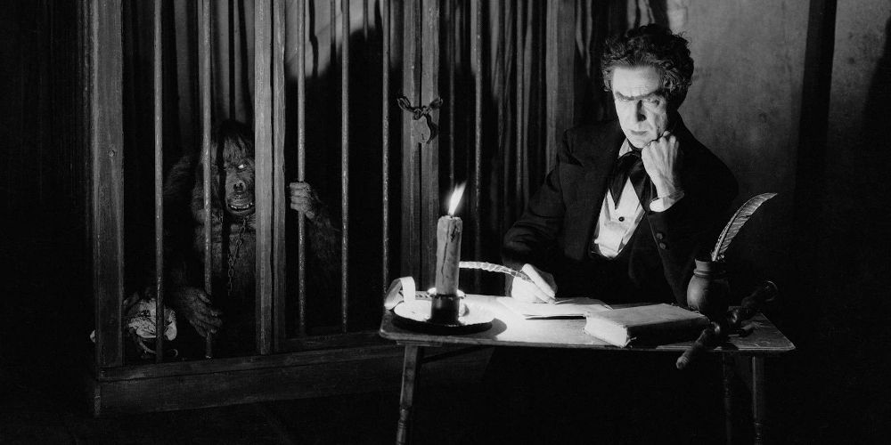 Bela Lugosi looks on in Murders in the Rue Morgue