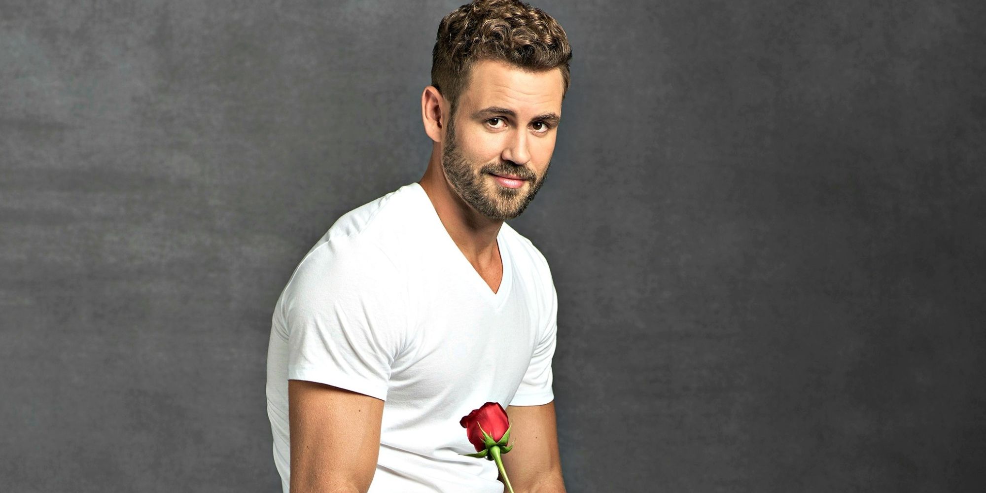 Nick Viall from The Bachelor holding a rose