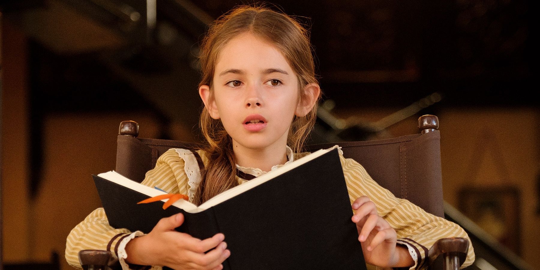 Trudi reading a book on the set in Once Upon a Time in Hollywood