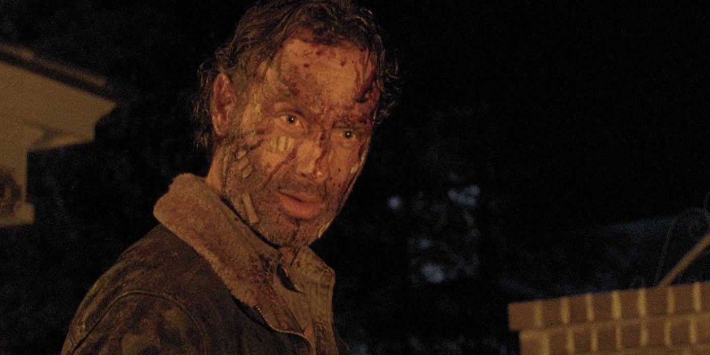 Rick kneeling looking broken in the fifth season finale of The Walking Dead.
