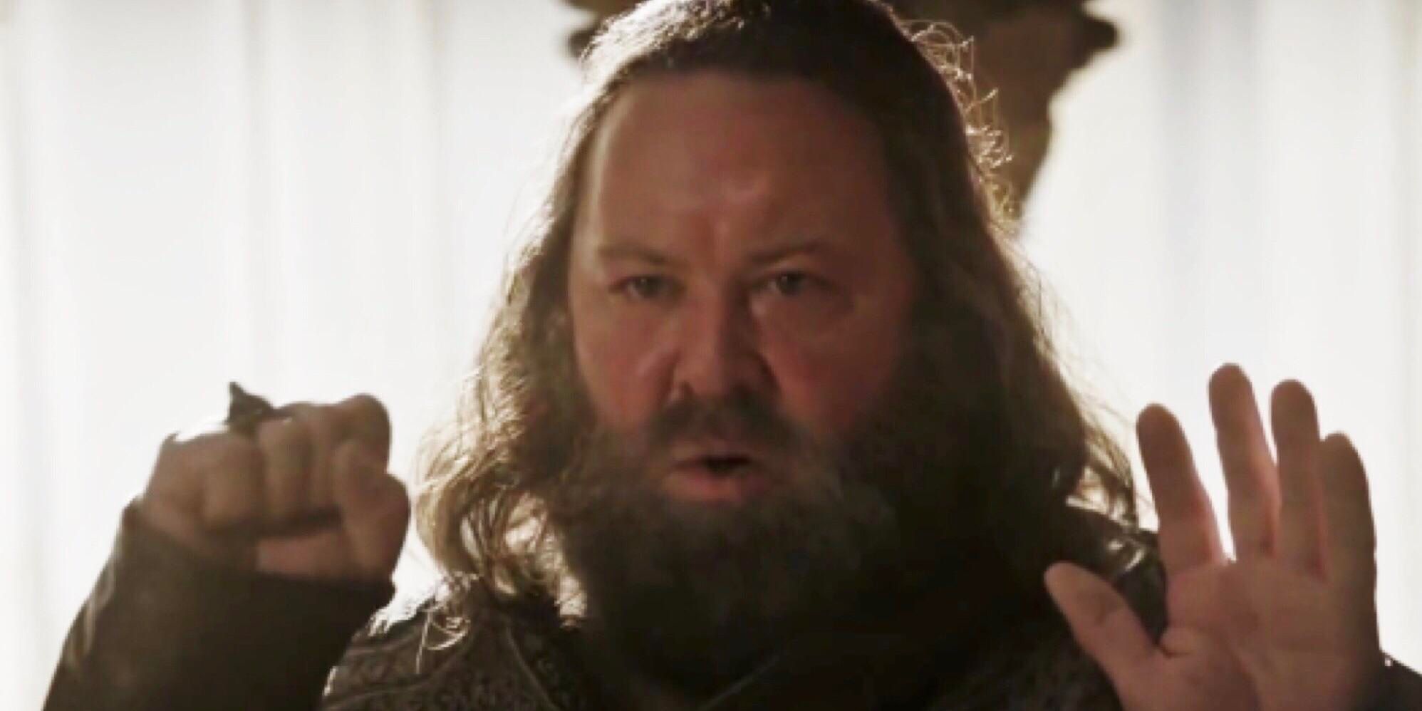 Robert Baratheon holds up his hands in Game of Thrones