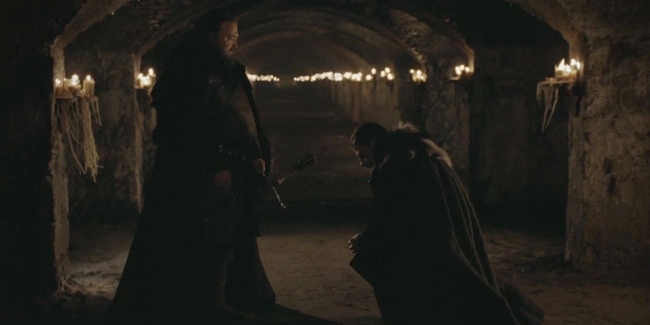 Ned kneeling in front of Robert in Game of Thrones
