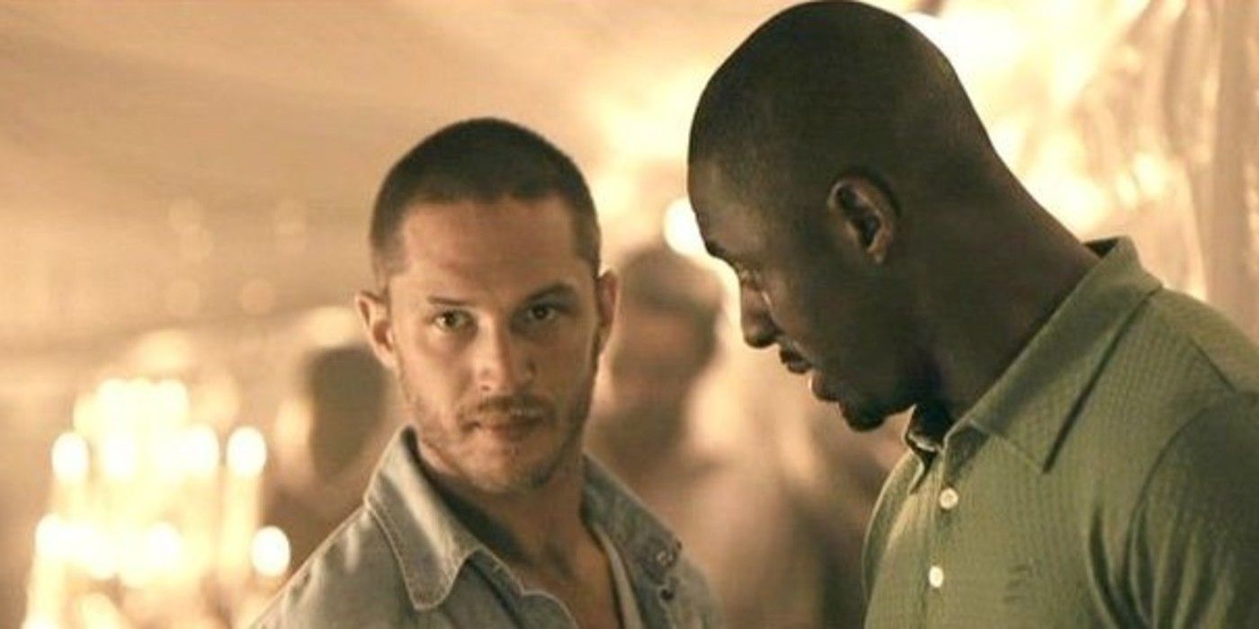 Tom Hardy and Idris Elba discussing something in RocknRolla