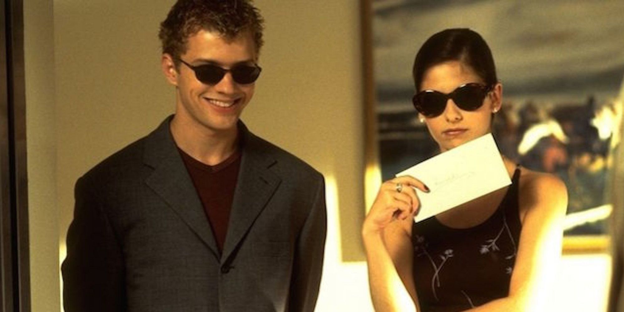 A man and a woman wearing sunglasses in Cruel Intentions.