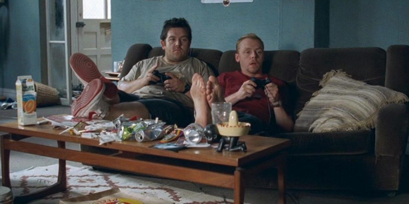 Shaun and Ed sit on the couch in Shaun of the Dead.