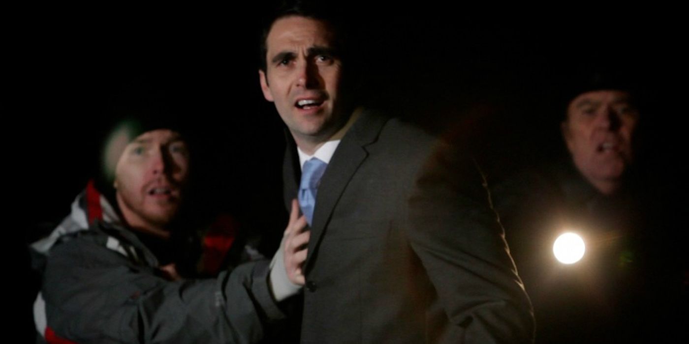 A still from the short film based on Stephen King's "One for the Road" - three men stand in a street at night