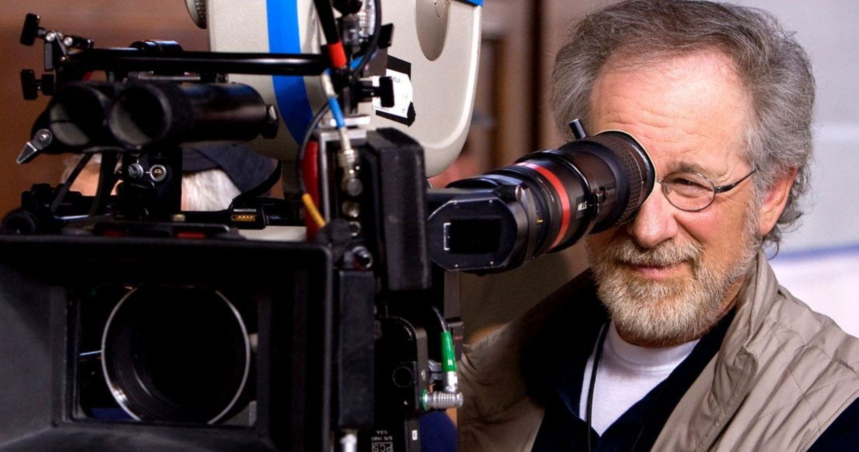 Steven Spielberg looking through a camera