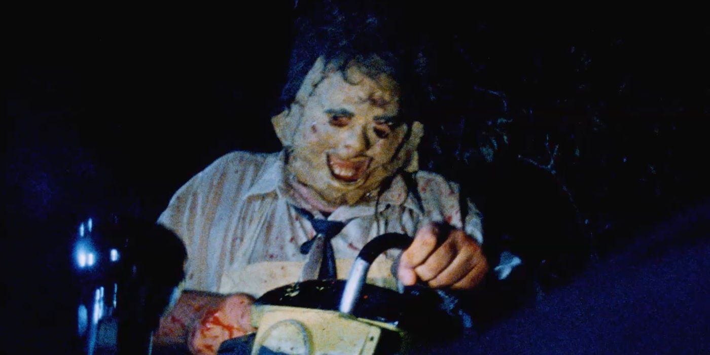 Leatherface smiling with a chainsaw in Texas Chainsaw Massacre
