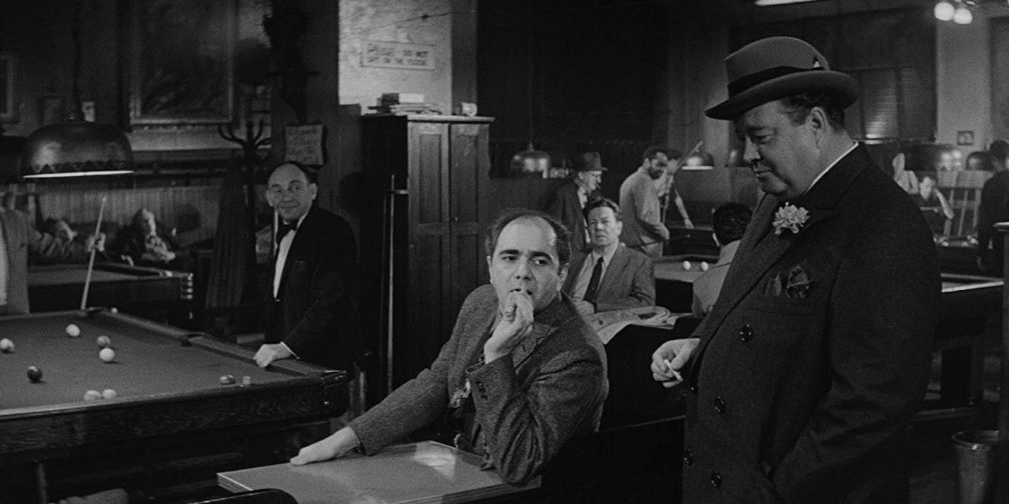 Two characters talking in a pool hall in The Hustler