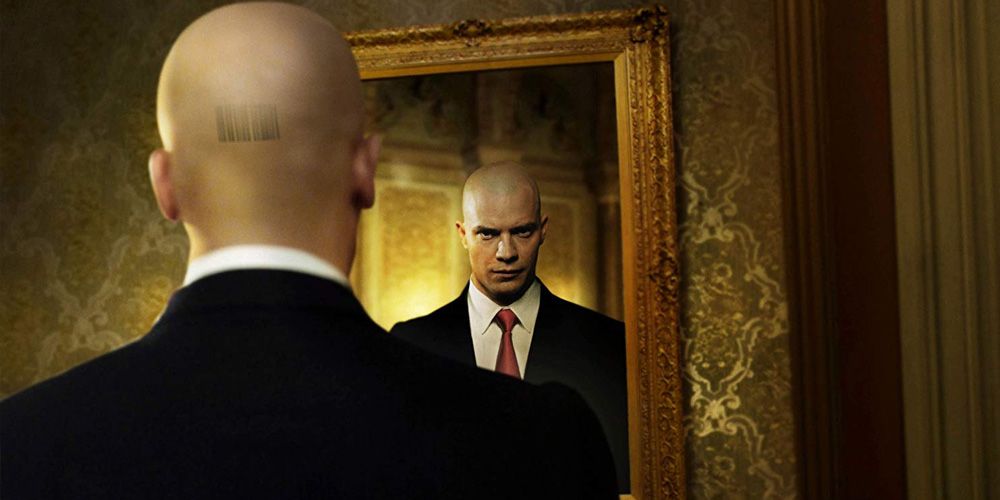 Agent 47 looks in a mirror in Hitman