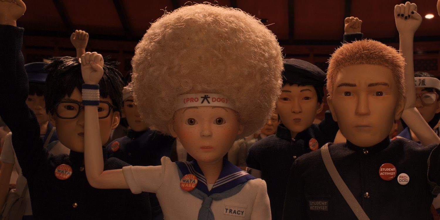 Various characters raise their stop-motion fists in the air in Isle of Dogs.