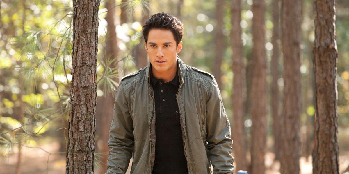 Tyler walking in the woods during daylight in The Vampire Diaries 