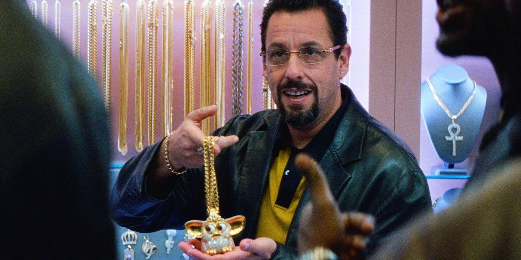 Adam Sandler's characters showing a Furby jewelry in Uncut Gems