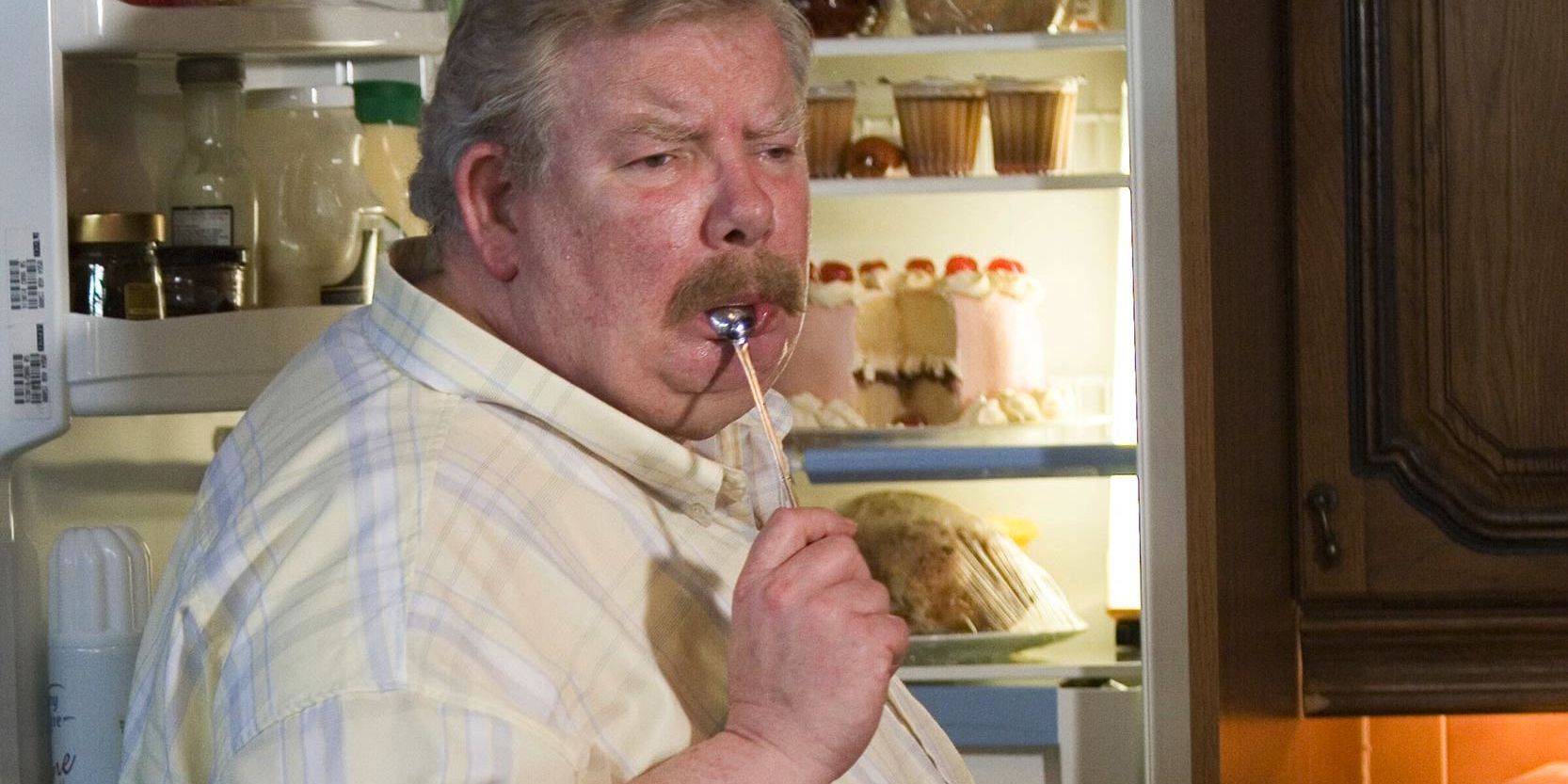 Vernon Dursley with a spoon in his mouth in Harry Potter.