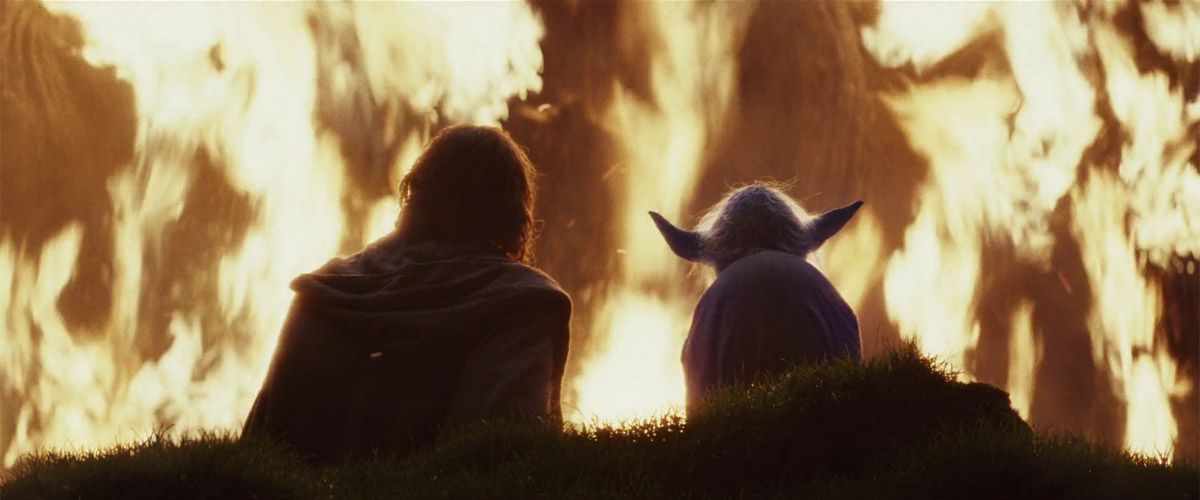 Yoda and Luke watch the Jedi tree burn on Ach-To in The Last Jedi
