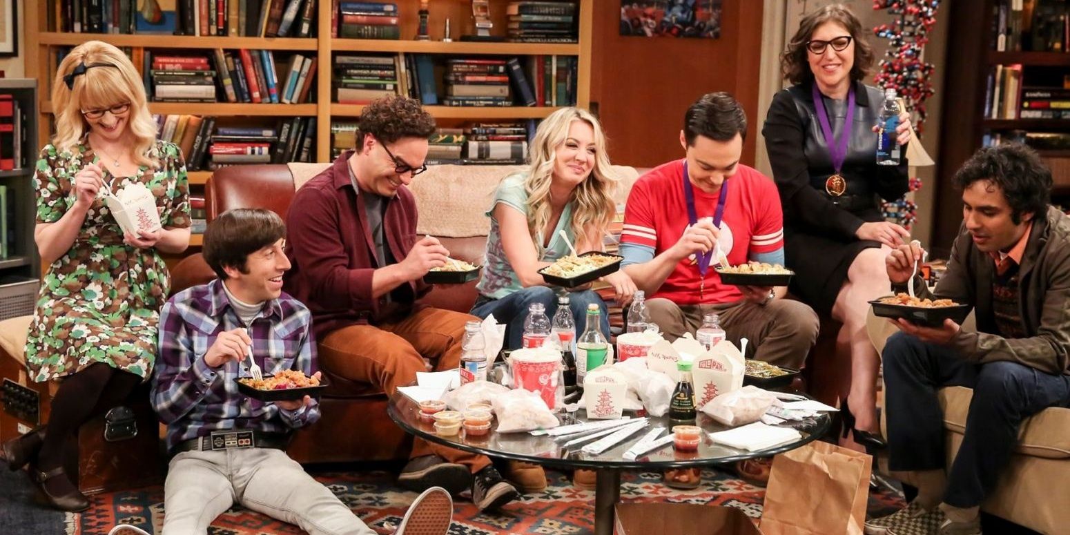 The gang eating takeout at Apartment 4A in The Big Bang Theory