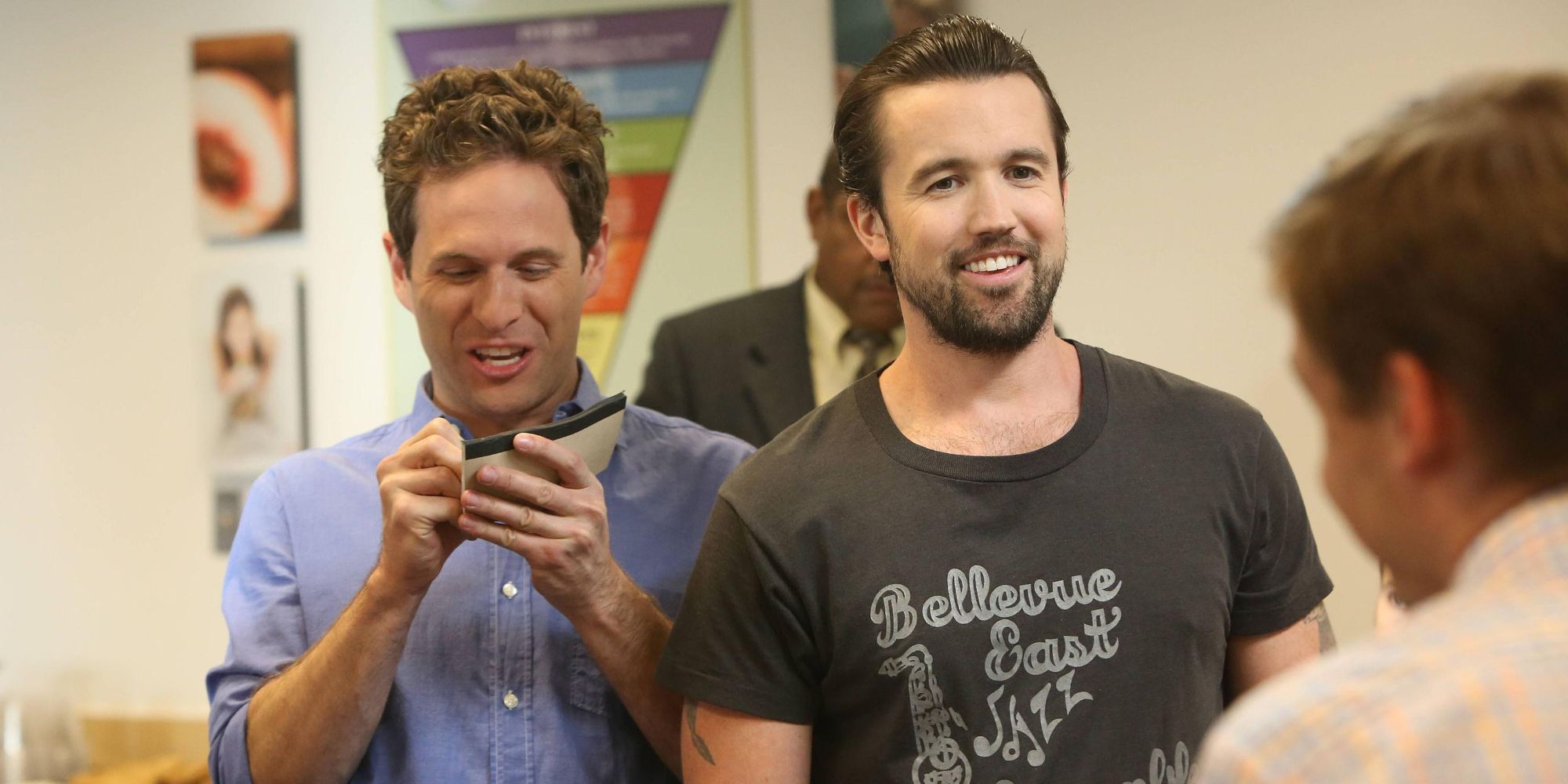 Mac and Dennis looking excited in It's Always Sunny in Philadelphia.