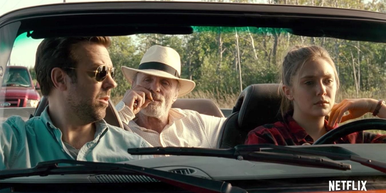 Elizabeth Olsen, Jason Sudeikis, and Ed Harris traveling in a car in a still from Kodachrome