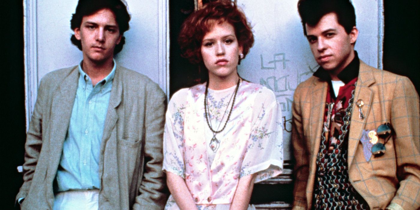 Blane, Andie, and Duckie leaning against a wall from Pretty in Pink. 