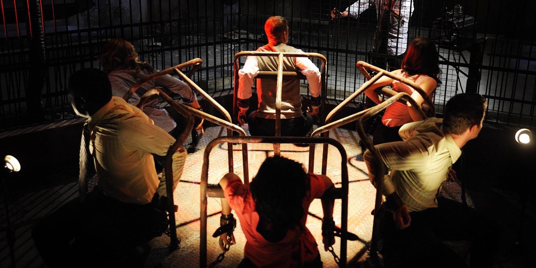 Victims sitting on a roundabout in Saw Vi