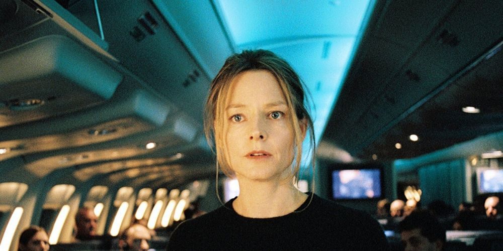 Jodie Foster standing in airplane aisle in Flightplan
