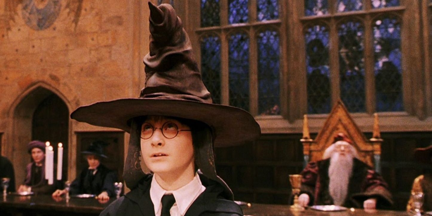 Harry sits with the Sorting Hat on his head in Harry Potter and the Sorcerer's Stone