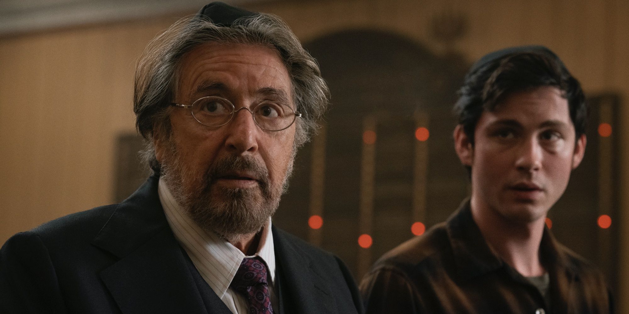 Al Pacino and Logan Lerman in Hunters looking surprised.