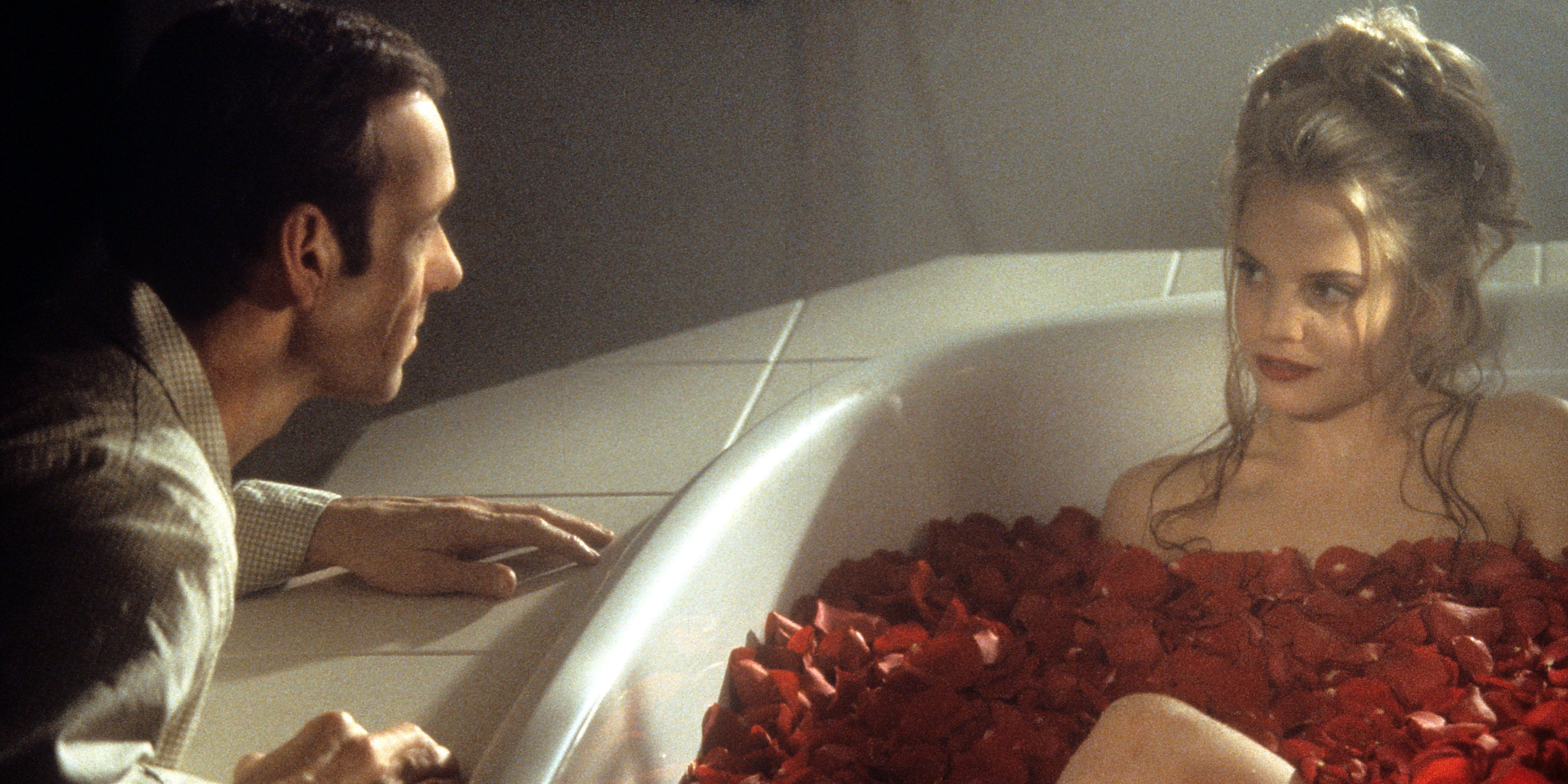 Kevin Spacey talks to a woman in a bathtub filled with roses in American Beauty