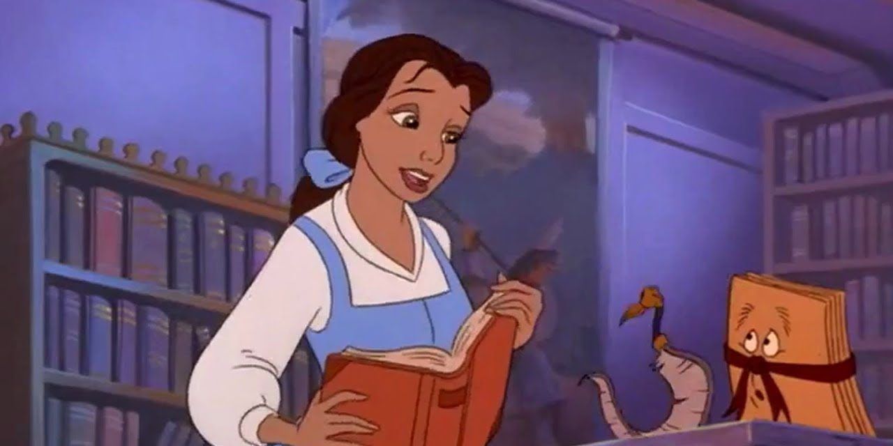 Belle at the library holding an open book