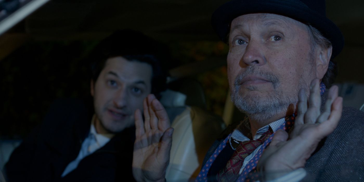 Ben Schwartz and Billy Crystal raising their hands in a car in Standing Up Falling Down